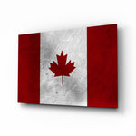 Flag of Canada Flag glass wall art displayed above a leather chesterfield in a Canadiana lounge with reclaimed-wood console and brass picture light
