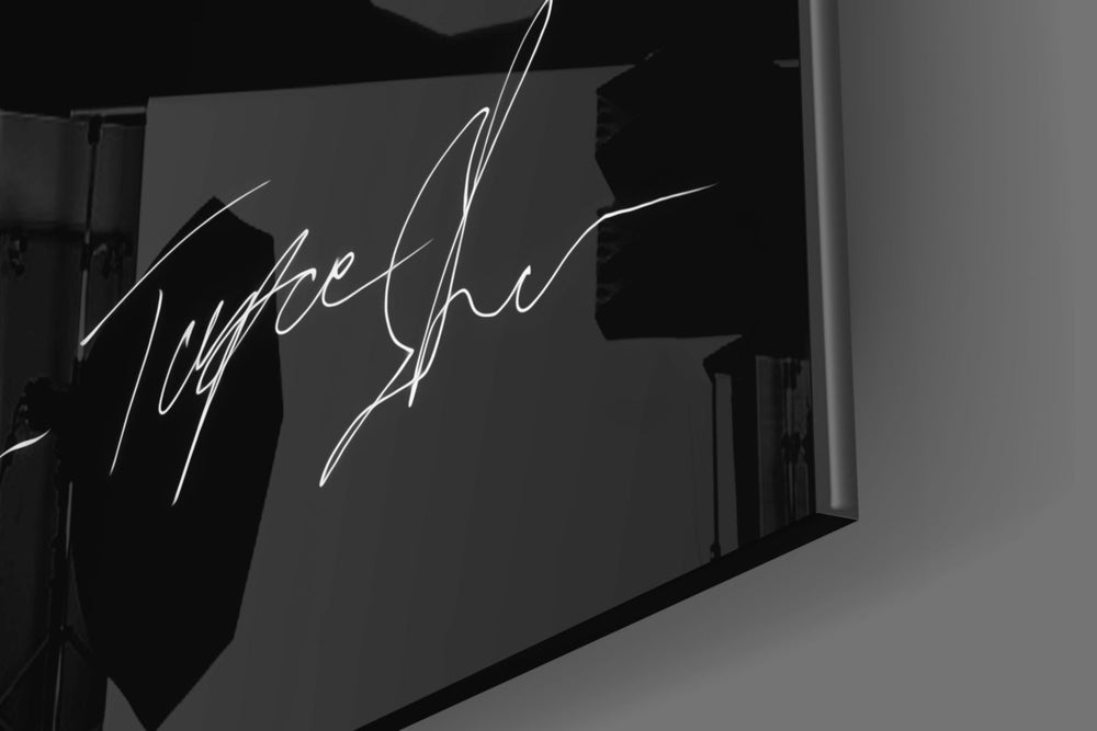 Tupac artwork anchoring a wall with moody motivational palette