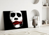 Joker close-up showing painterly face with smeared crimson grin on onyx