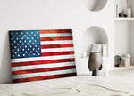 Flag of the United States close-up showing stars and stripes on cracked plaster