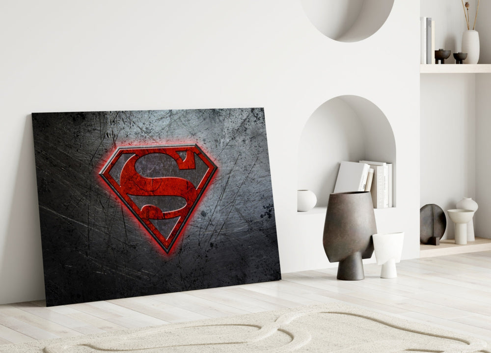 Superman close-up showing crimson shield on brushed-steel field with scratches