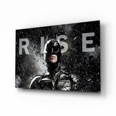 Batman Rise glass wall art displayed above a black leather sectional in a moody home theater with brass arc lamp and reclaimed-wood console