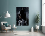 Batman glass wall art styled above a console in a gaming room