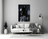 Batman close-up showing Dark Knight cowl in painterly profile through falling rain