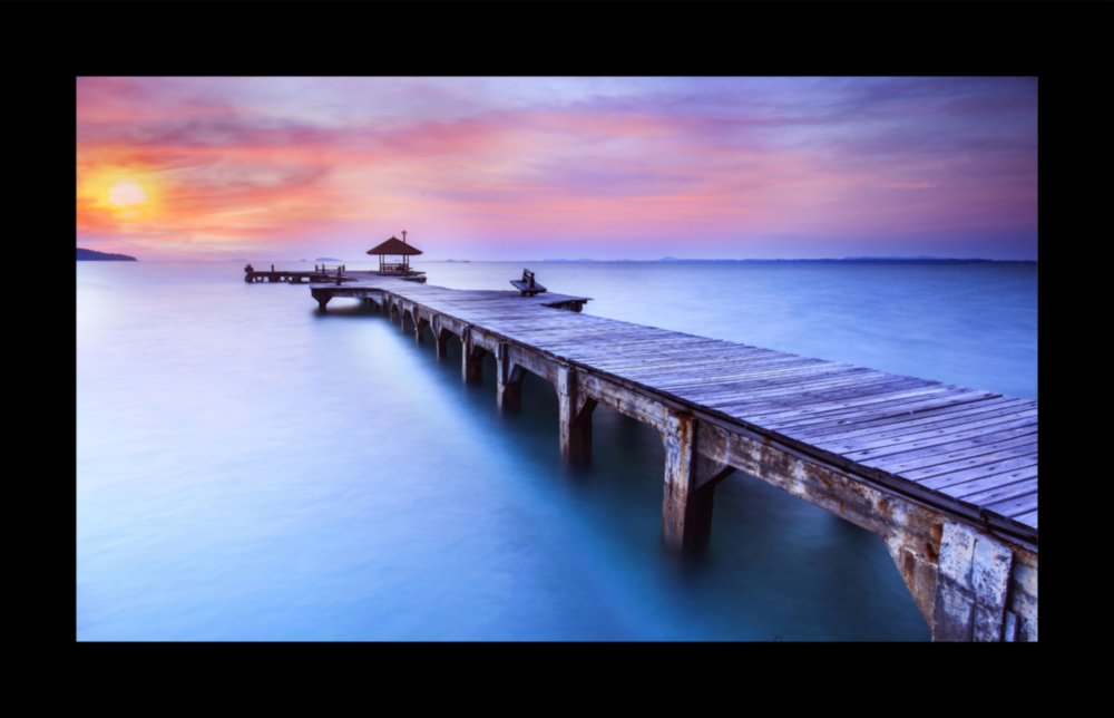 Sunset at the Pier Glass Wall Art