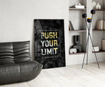 Push Your Limit gold panel anchoring an entrepreneur's office wall
