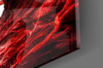 Close-up detail of the red sinew and bone-black fangs behind glass