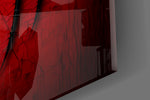 Close-up detail of the black spider relief on cracked red surface