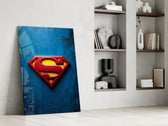 Superman shield artwork above a gaming setup with ambient light