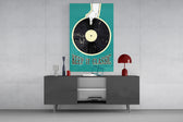 Keep It Classic teal glass wall art catching light to reveal its poster texture
