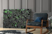 Moody botanical artwork in a creative office with low light