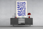 Periwinkle abstract glass wall art catching light to reveal its flat-color cuts