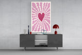 Heart sunburst glass wall art catching light to reveal its flat-color cuts