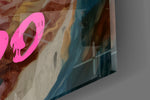 Close-up detail of the powdered aristocrat and pink graffiti type behind glass