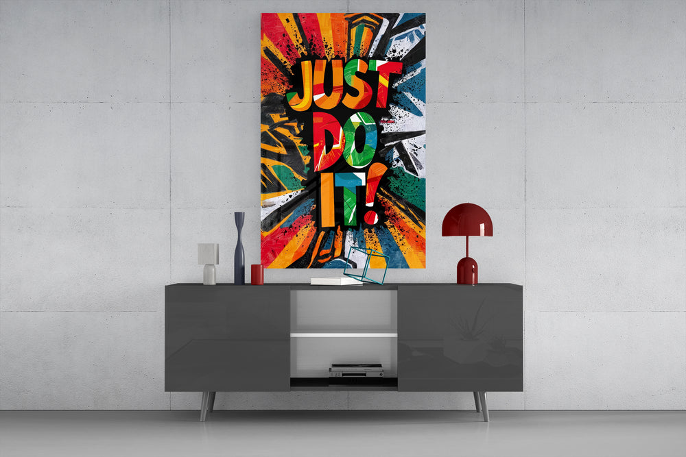 Just Do It glass wall art catching light to reveal its splatter texture