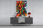 Just Do It glass wall art catching light to reveal its splatter texture