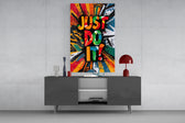 Just Do It glass wall art catching light to reveal its splatter texture