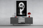 Eyes of the Abyss glass wall art catching light to reveal its inked hatching