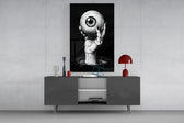 Eyes of the Abyss glass wall art catching light to reveal its inked hatching