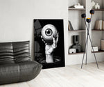 Eye-and-hand panel against a moody black-painted accent wall