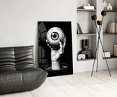 Eye-and-hand panel against a moody black-painted accent wall