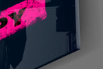 Close-up detail of the distressed color swatches and black sans-serif behind glass