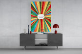 Positive Energy glass wall art catching light to reveal its painted brushwork