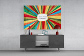 Positive Energy wide glass wall art catching light to reveal its painted brushwork
