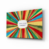 Positive Energy horizontal sunburst glass wall art above a modern sofa