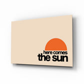 Here Comes The Sun horizontal glass wall art in a modern bright living room