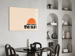 Minimal sunrise panel against a clean white-painted accent wall