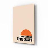 Here Comes The Sun vertical glass wall art in a modern bright living room