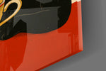 Close-up detail of the black cat and steaming coffee cup behind glass
