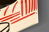 Close-up detail of the black cat on coral wicker sofa behind glass