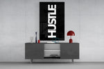 Hustle glass wall art catching light to reveal its high-contrast typography