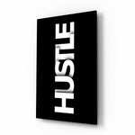 Hustle minimalist typography glass wall art in a modern executive office