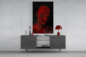 Red Tangle Portrait glass wall art catching light to reveal its threaded line work