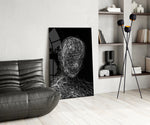 Threaded-portrait panel against a moody black-painted accent wall