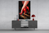 Red Stiletto Heels glass wall art catching light to reveal its oil brushwork