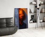 Surreal portrait panel against a moody dark-painted accent wall