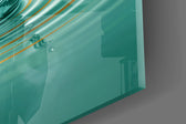 Close-up detail of the gilded lotus petals and the rippling teal water crown on the glass surface