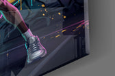 Close-up detail of the spread black wings and the raptor head mid-dunk on the glass surface