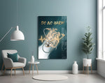 do no harm stethoscope and golden heart glass wall art styled above an armchair in a reading corner