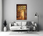 gold real estate key with a skyline panel bringing character to a minimalist living room wall