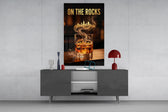 whiskey glass with a golden skyline glass wall art displayed above a console in a designer interior