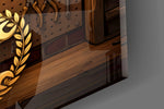 Close-up detail of the crossed wrenches and piston emblem in a laurel wreath on the glass surface