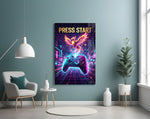a neon game controller and pixel phoenix glass wall art styled above an armchair in a reading corner