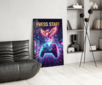 a neon game controller and pixel phoenix glass wall art leaning beside a dark leather sofa