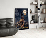 the city is watching moonlit dunk glass wall art leaning beside a dark leather sofa