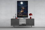 basketball player palming the moon glass wall art displayed above a console in a designer interior